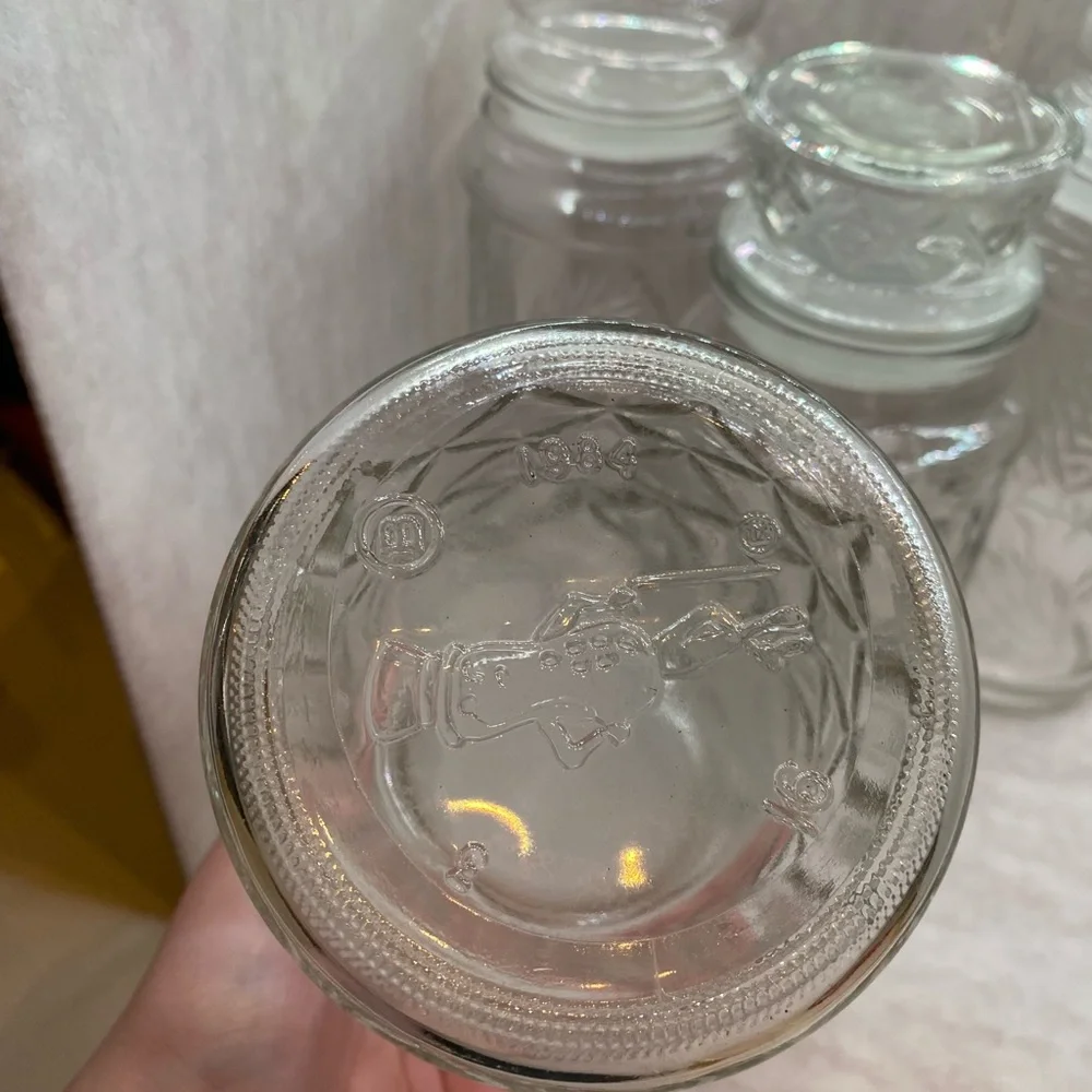 4 VINTAGE PLANTERS MR PEANUT GLASS JARS WITH LIDS (2) 1982, 1983, 1984